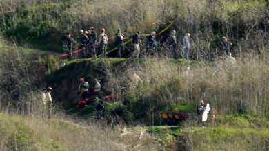 Investigators on Jan. 27, 2020, work the scene of a helicopter crash that killed former NBA basketball player Kobe Bryant, his 13-year-old daughter, Gianna, and seven others in Calabasas, California.