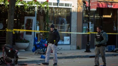 More than a dozen remain hospitalized after deadly Waukesha parade crash. Police are seen at the Christmas parade site on November 22, in downtown Waukesha, Wisconsin.