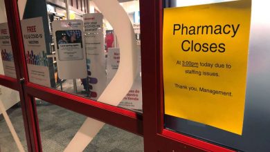 A sign is posted outside a CVS pharmacy on Thursday, in Indianapolis.