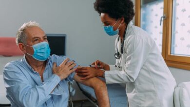 A healthcare professional administers a shot. Health officials in southwestern Utah said this week they believe the omicron wave of COVID-19 may have reached its peak after pushing case counts, hospitalizations and reported deaths to their highest numbers of the pandemic in January.