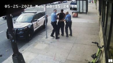 This image from video shows Minneapolis police Officers Thomas Lane, left and J. Alexander Kueng, right, escorting George Floyd, center, to a police vehicle in Minneapolis, on May 25, 2020. The trio's federal trial is expected to begin Monday with opening statements.