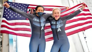 Elana Meyers Taylor (silver medal) and Kaillie Humphries (gold medal) celebrate after going one-two in the monobob competition.