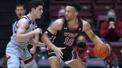 Utah guard Marco Anthony (10) is defended by Stanford guard Michael O'Connell during the first half of an NCAA college basketball game in Stanford, Calif., Thursday, Feb. 17, 2022.