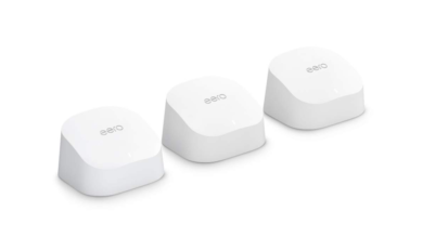 Three white, sloped Eero 6 Wi-Fi mesh network devices.