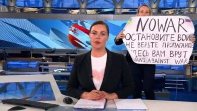 This screenshot taken on March 15, 2022, shows Russian Channel One editor Marina Ovsyannikova holding a poster reading