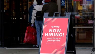 A hiring sign is displayed outside of a retail store in Vernon Hills, Ill., Saturday, Nov. 13, 2021.
